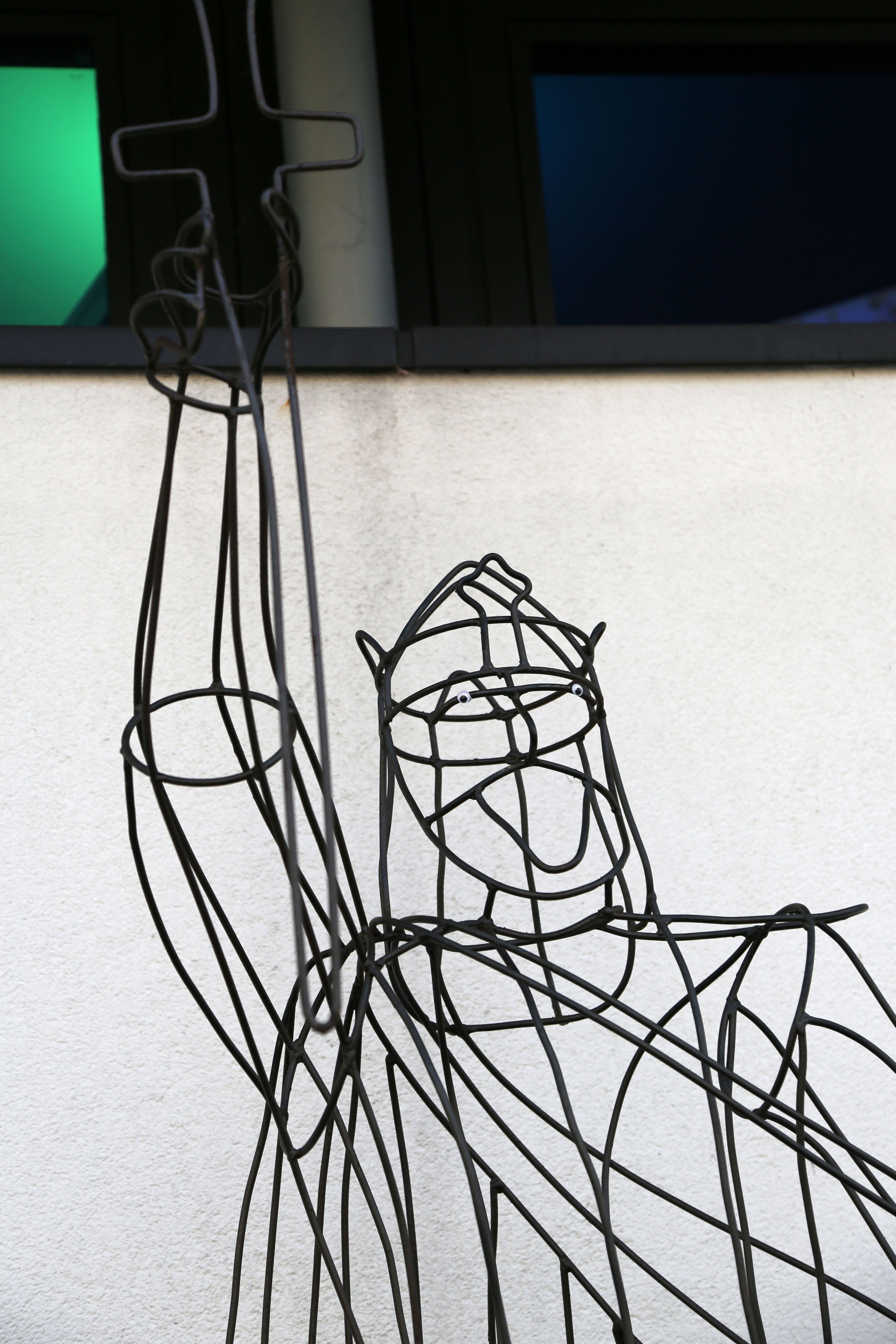 A metal statue of King Alfred, complete with googly eyes