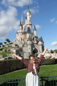 Rosie stood infront of Sleeping Beauty's Castle in Disneyland Paris