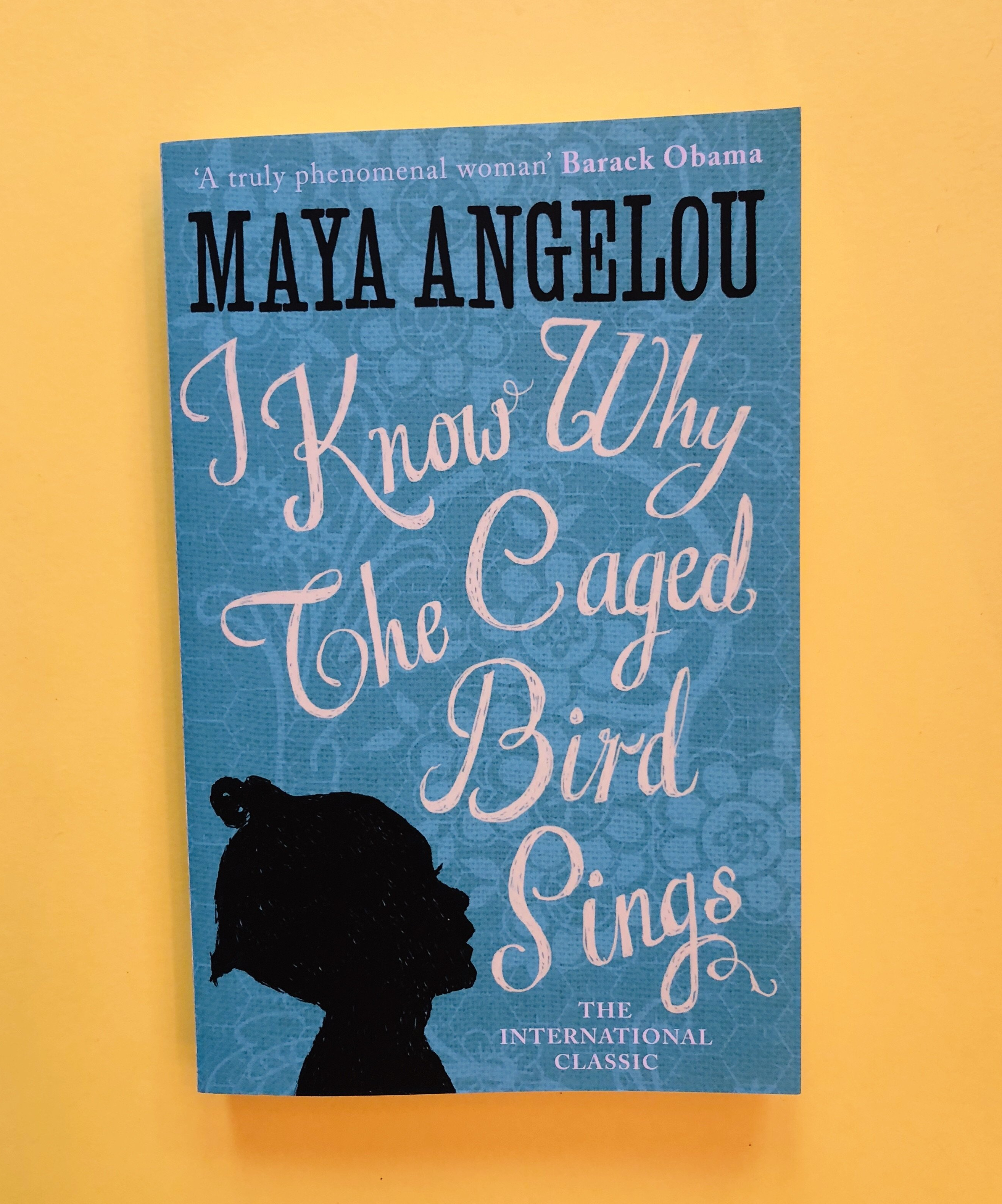 Blue cover of Angelou's novel against a yellow background - taken from