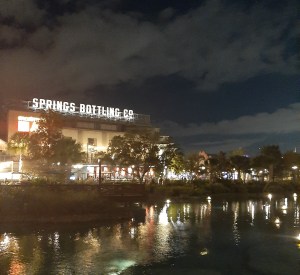 Springs Bottling Co against a dark dusk sky