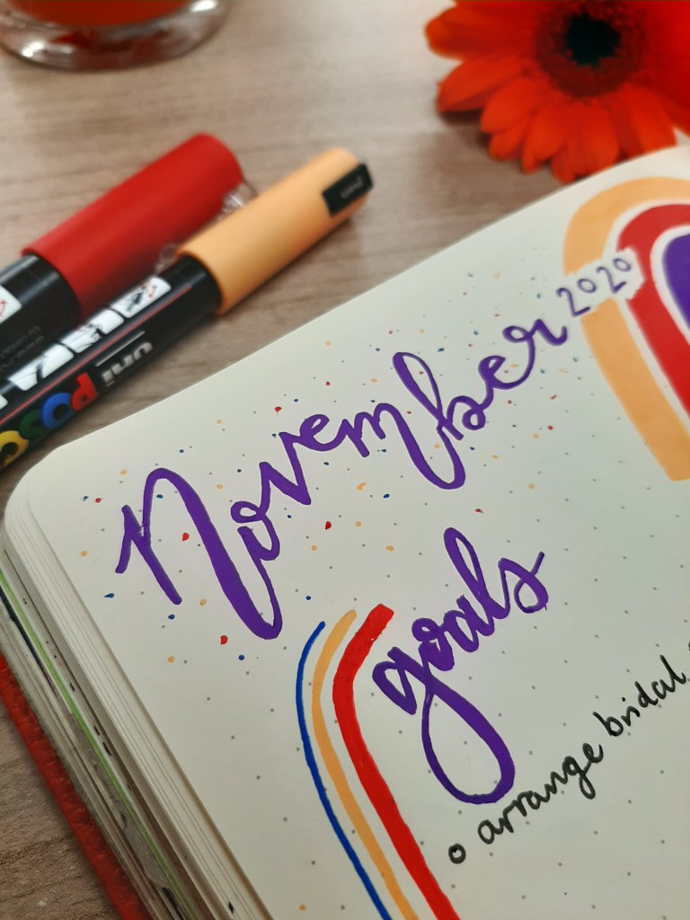 Close up of the title "November", written in purple calligraphy