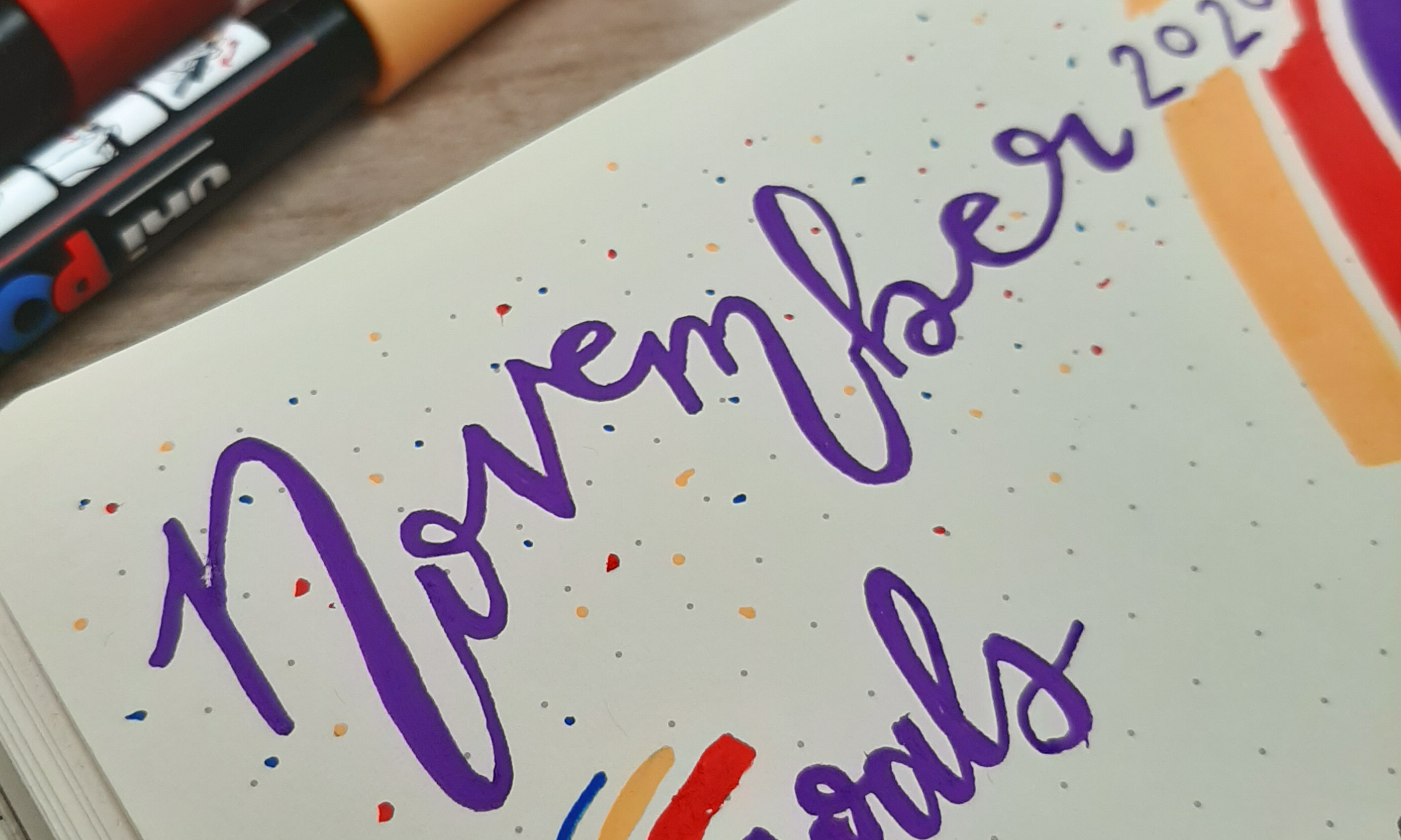 November written in purple calligraphy