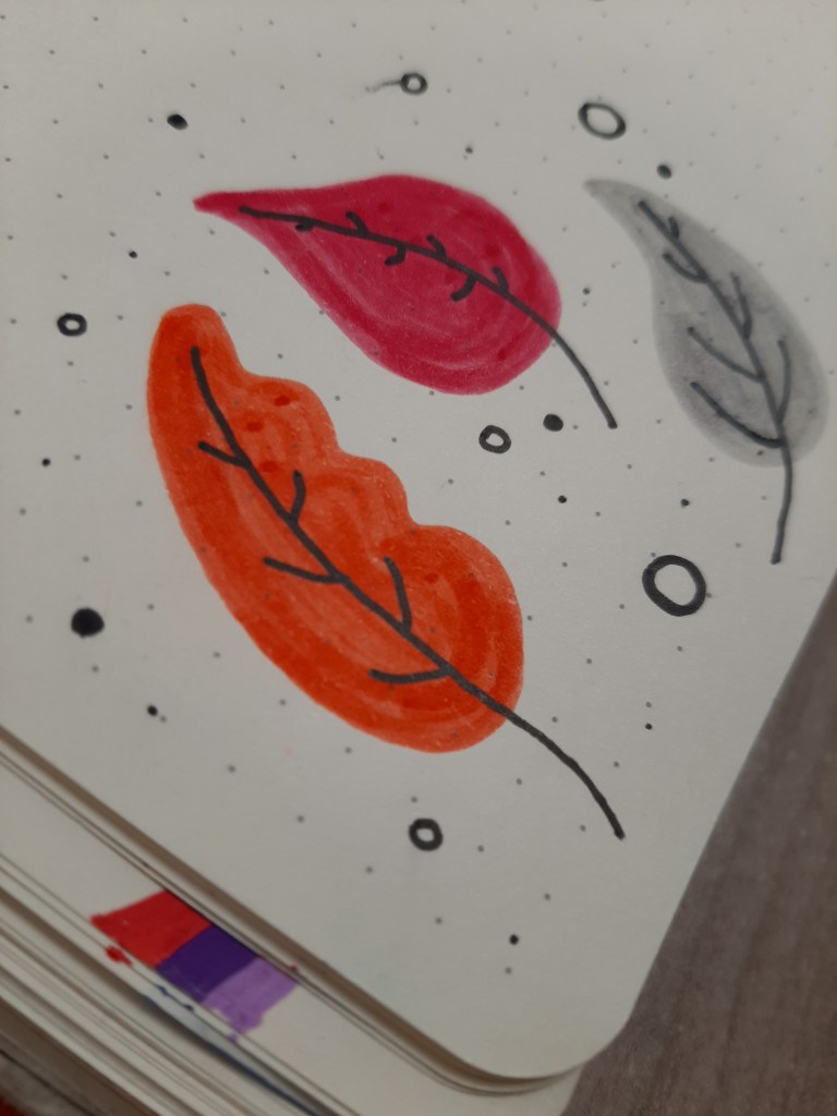 Three drawn leaves - one orange, one pink, one grey