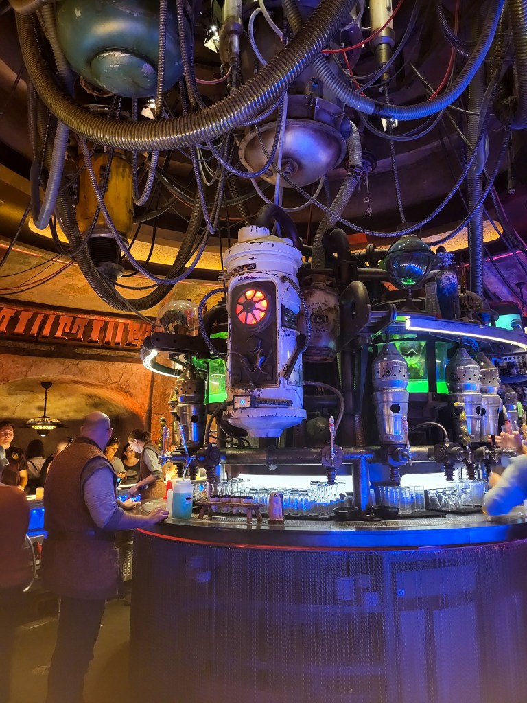 A space-esque looking bar, complete with wires and low lighting